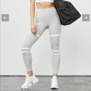 Alo yoga silver and white long  leggings. Never been worn.